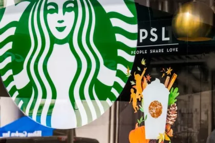 A Starbucks storefront advertising the annual Pumpkin Spice Latte