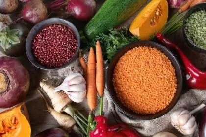 An assortment of fall produce, healthy grains, and dry legumes and lentils