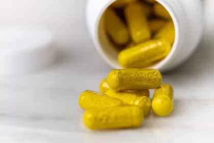 Capsules filled with yellow herbal supplement powder resembling toxic yellow oleander