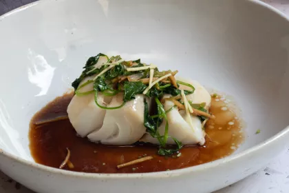 bowl with cod in sauce