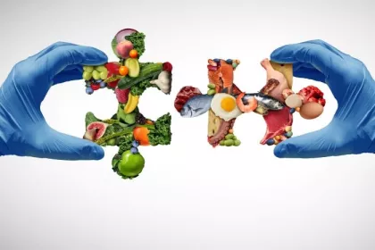 Nutrition science concept with food-group puzzle pieces held by hands in surgical gloves