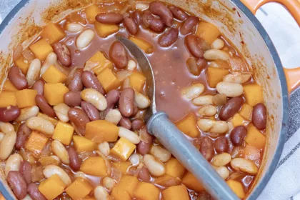 large pot of stew with a grey spoon in the pot