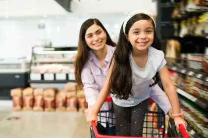 A woman and girl grocery shop