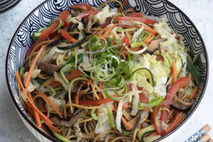 bowl of noodles and cut vegetables