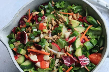 large bowl of salad with chopped lettuce and other vegetables