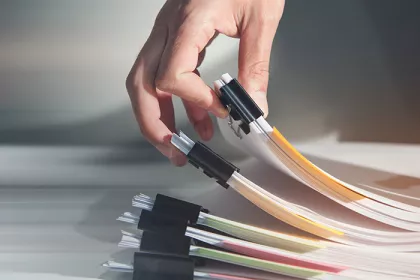 Hand holding report paper