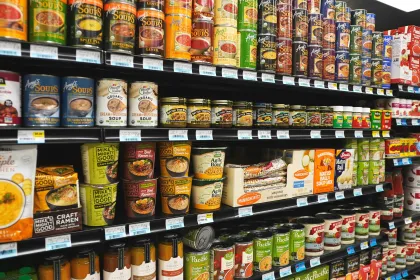 A grocery aisle featuring canned and dried soups