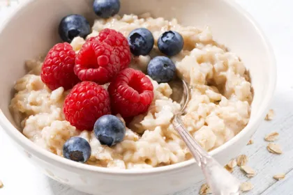 bowl of oatmeal with raspberries and blueberries