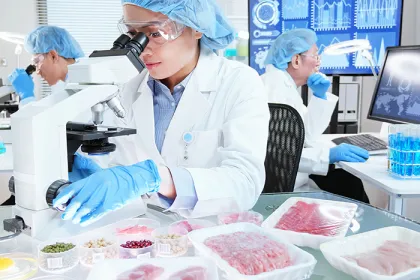 Food safety workers inspecting foods in a laboratory