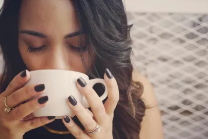 a woman drinking coffee