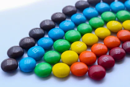 M&Ms candy arranged by color to resemble a rainbow