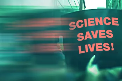 A protest sign that says "Science Saves Lives!"
