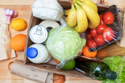A box of perishable and non-perishable food items for donation