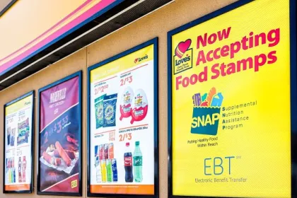 Exterior signage at a convenience store; closeup for SNAP (food stamps)