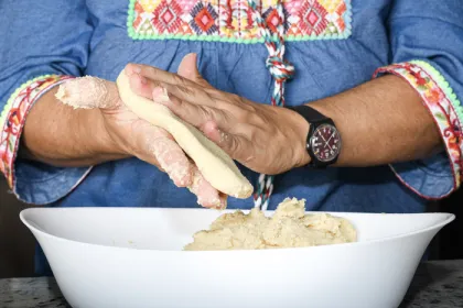 woman's hands making a corn flour tortilla