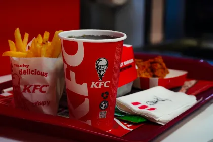 A KFC meal prominently featuring a fountain soda