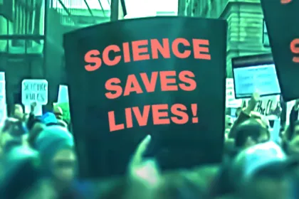 Sign held up at a rally that says, "Science saves lives!"