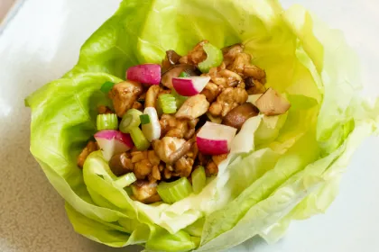 lettuce cup filled with various vegetables and tempeh