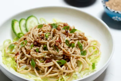 white bowl filled with sesame noodles
