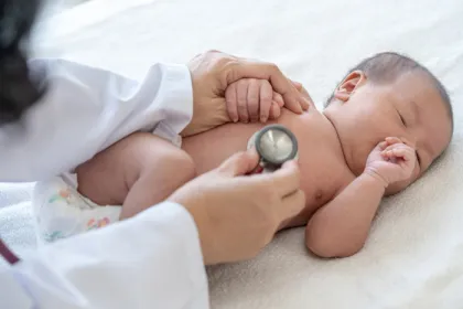 doctor listening to a baby's heart