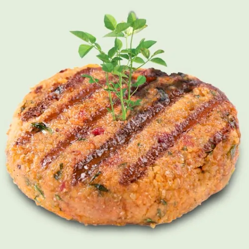 grilled plant based burger patty with green sprout coming out