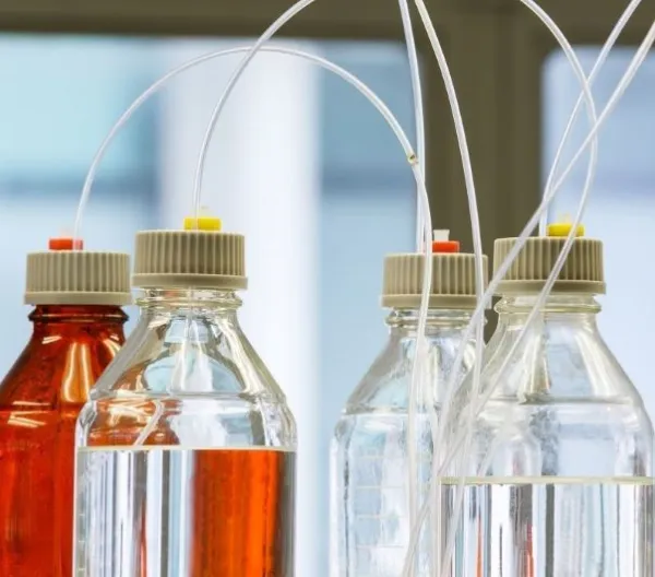 Glass bottles with plastic hose in flavor laboratory