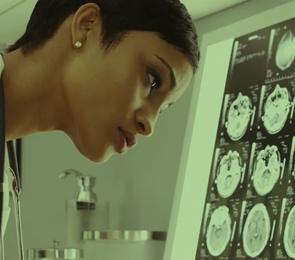 doctor looking at brain scans in lab