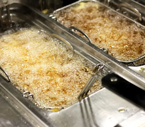 fryer with bubbling oil inside