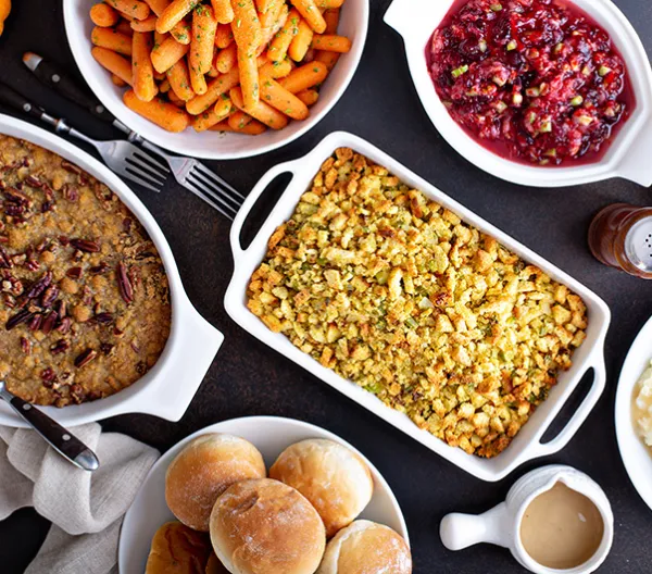 Variety of dishes at a Thanksgiving meal table