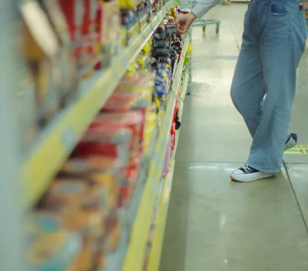 Person browsing packaged foods.