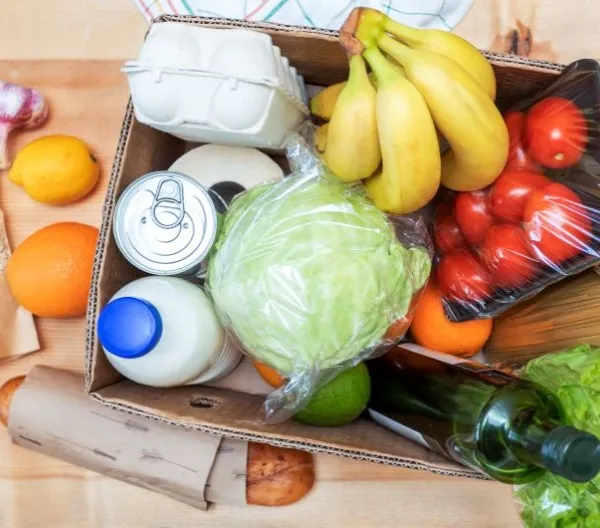 A box of perishable and non-perishable food items for donation