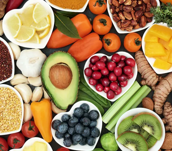Assortment of different types of foods in heart-shaped bowls