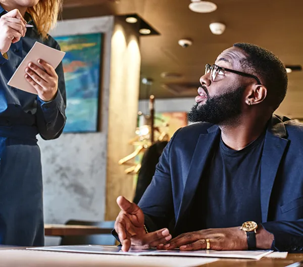 Person reading menu at a restaurant