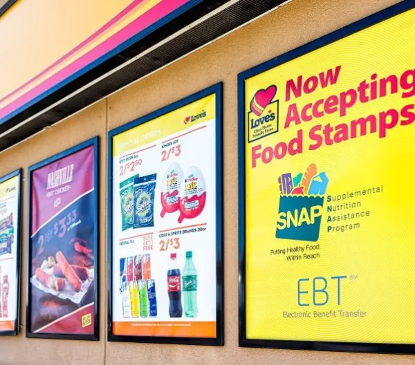 Exterior signage at a convenience store; closeup for SNAP (food stamps)