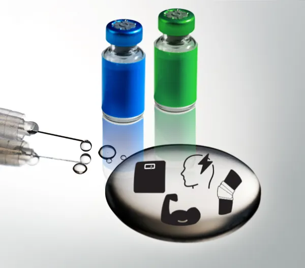 syringe with puddle of clear liquid and 2 vials