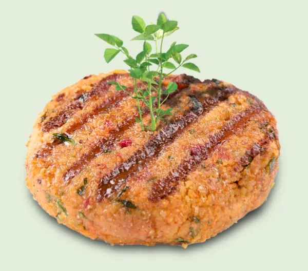 grilled plant based burger patty with green sprout coming out