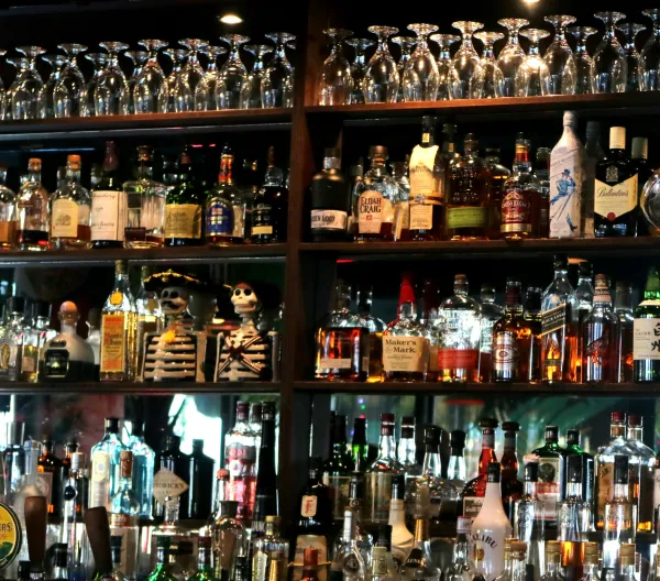 Bar shelf with a variety of liquor