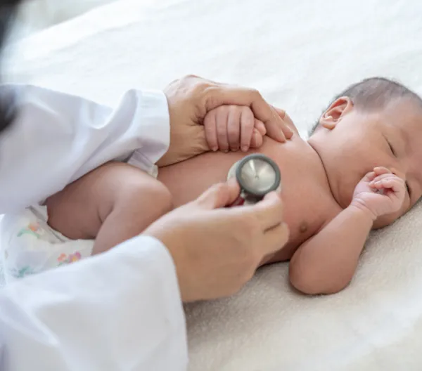 doctor listening to a baby's heart