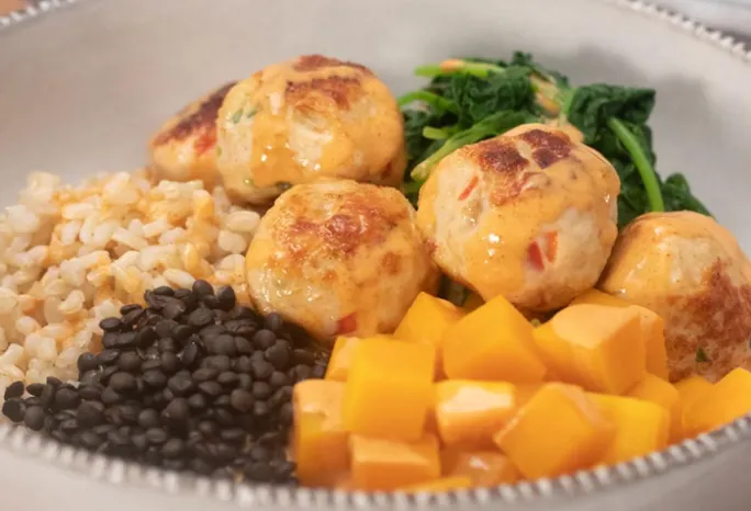chicken meatballs with an assortment of sides
