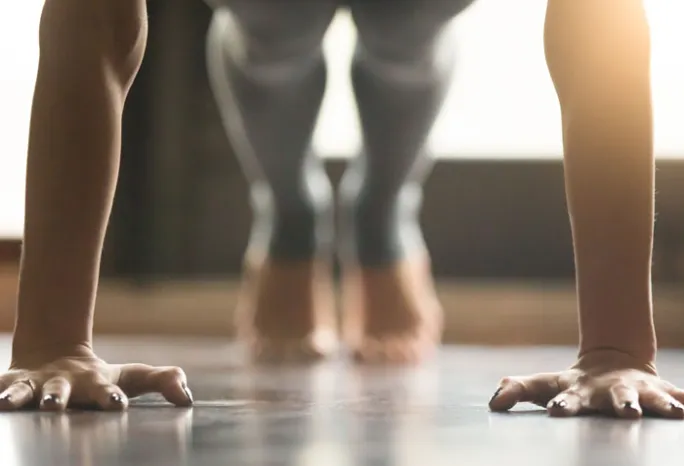 person doing straight-arm plank exercise