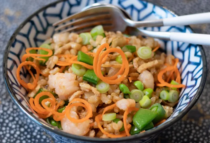 Bowl filled with various vegetables and fried rice