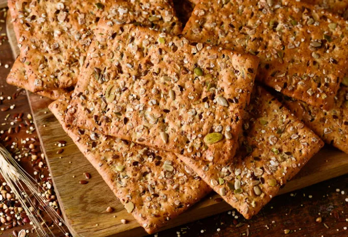 crackers laid out on a cutting board