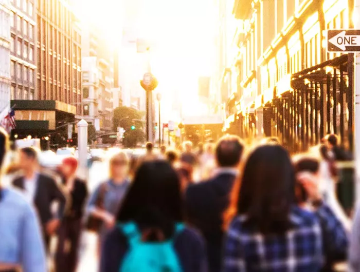 people walking on a city street