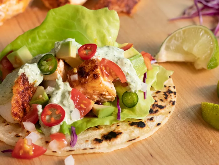 creamy cilantro sauce on a fish taco