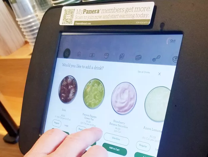 person using a digital restaurant ordering machine