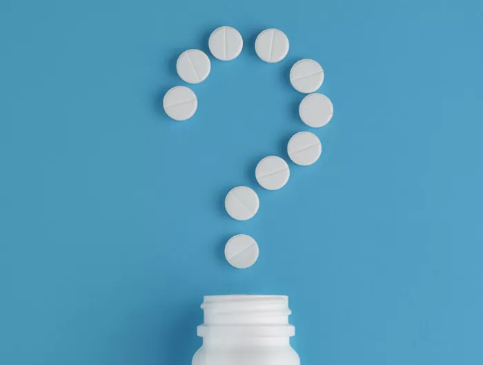 pills in a question mark shape