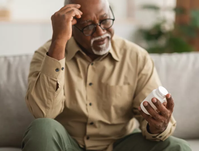 man holding pills