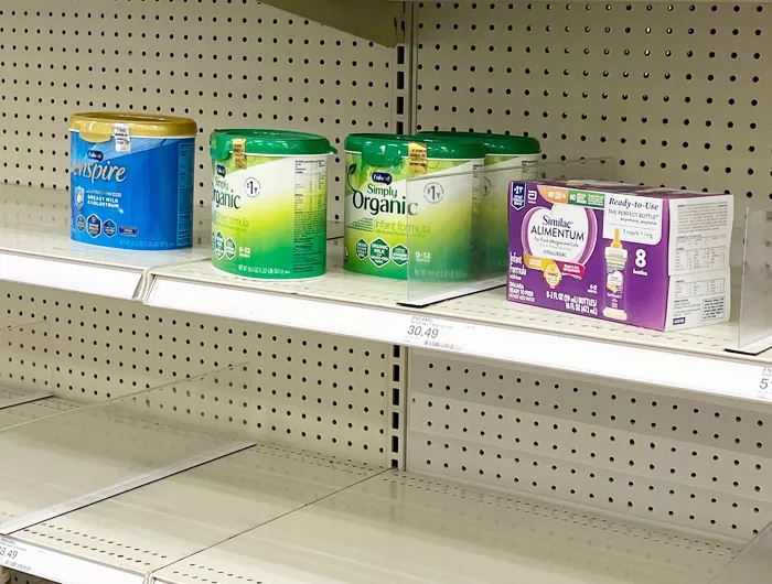 A mostly-empty shelf of infant formula