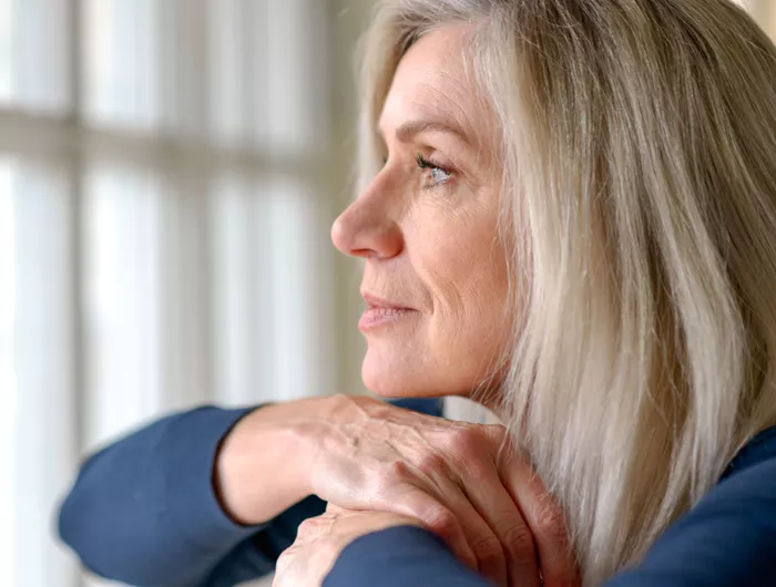 woman looking out the window