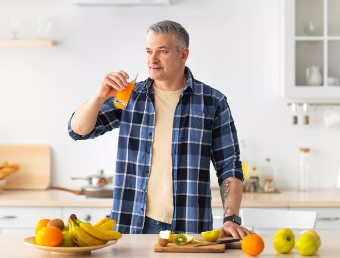 man drinking juice